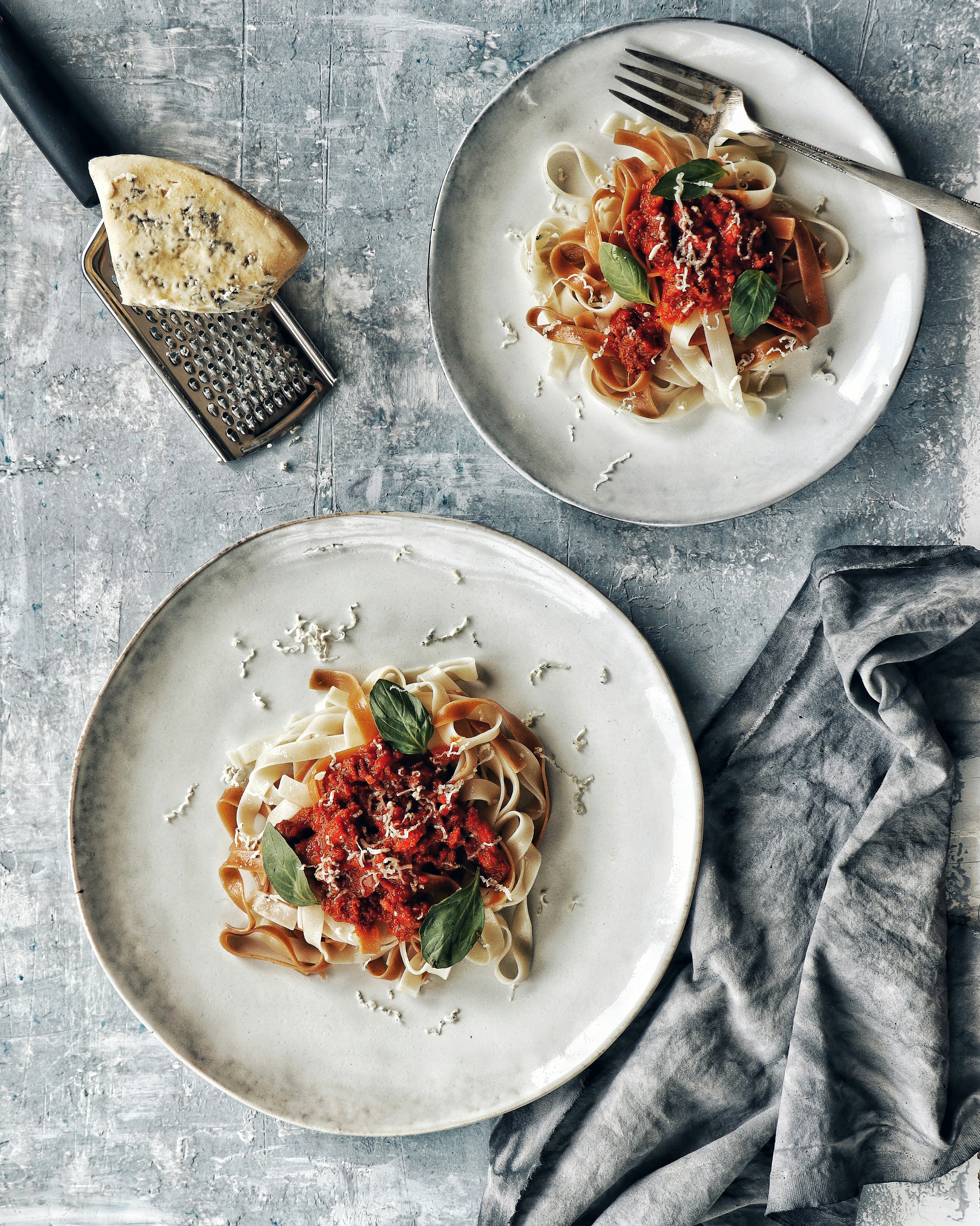 Fresh tagliatelle pasta with tomato and basil